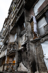 Fototapeta na wymiar KYIV, UKRAINE - APR 21, 2022: The facade of an apartment building on Koshytsia str. was destroyed by the Kalibr cruise missile on the second day of the full-scale Russian invasion of Ukraine.