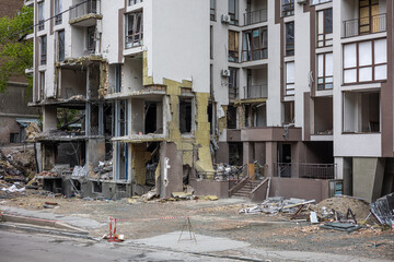 KYIV, UKRAINE - MAY 22, 2022: The facade a lower floorsof an apartment building on Tatarka was destroyed by the Kalibr cruise missile on the second day of the full-scale Russian invasion of Ukraine.