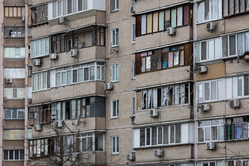 Fototapeta na wymiar KYIV, UKRAINE - APR 21, 2022: The facade of an apartment building on Koshytsia str. was destroyed by the Kalibr cruise missile on the second day of the full-scale Russian invasion of Ukraine.