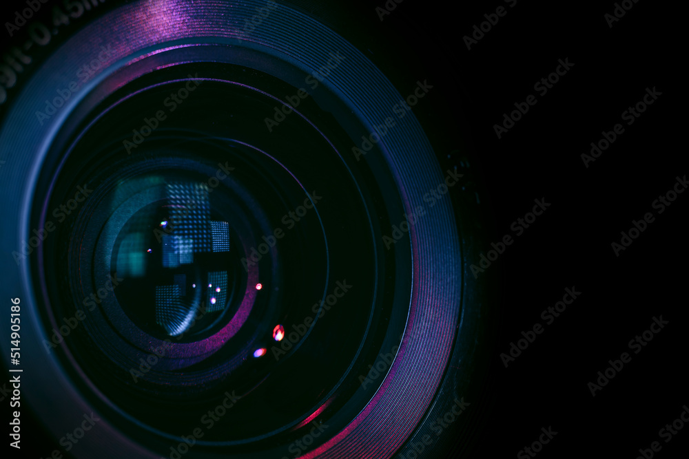Aufkleber Close up Beautiful camera lens with multi colored light. Background pattern for design..