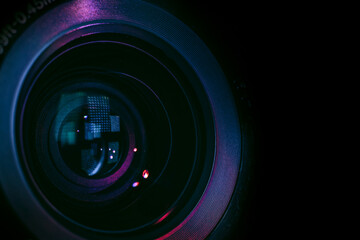 Close up Beautiful camera lens with multi colored light. Background pattern for design..