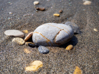 Fototapeta na wymiar colorful stones on the beach on a sunny day