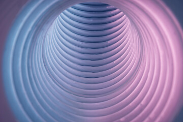Beautiful round abstract white-gray tunnel with color light on a background pattern textured ford...