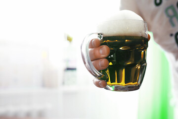 Saint Patrick's Day holiday. National Irish holiday. A mug of golden beer at the bar.