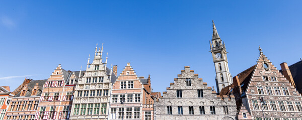 Fototapeta na wymiar Ancient gable houses along the Korenlei in Ghent port city in northwest Belgium during a sunny day