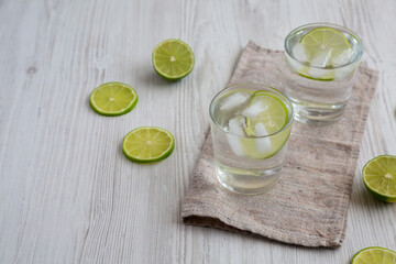 Obraz na płótnie Canvas Refreshing Ice Water with Lime Ready to Drink