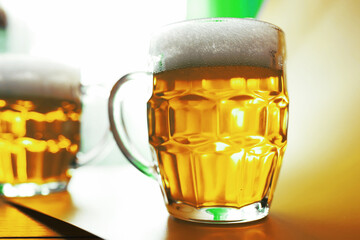 Saint Patrick's Day holiday. National Irish holiday. A mug of golden beer at the bar.