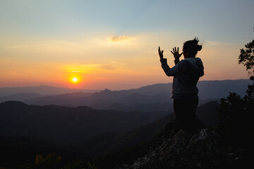 woman worship on sunset