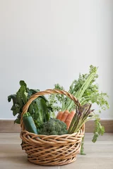 Fotobehang Fresh vegetables basket picked in the garden. Proximity vegetable purchase concept. © Ladanifer