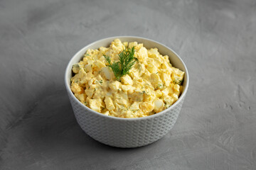 Homemade Egg Salad with Dill in a Bowl, side view.