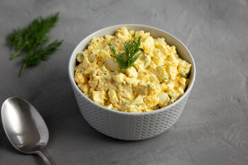 Homemade Egg Salad with Dill in a Bowl, side view.