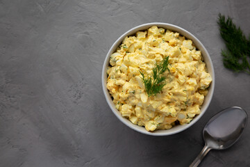Homemade Egg Salad with Dill in a Bowl, top view. Flat lay, overhead, from above. Copy space.
