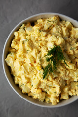 Homemade Egg Salad with Dill in a Bowl, top view. Flat lay, overhead, from above. Close-up.