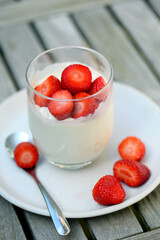 Glass with yogurt and strawberries