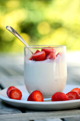 Glass with yogurt and strawberries