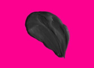 Black mud face mask, dark cosmetic product sample isolated on pink background