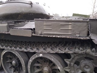 Military equipment, a close-up battle tank on a tracked track