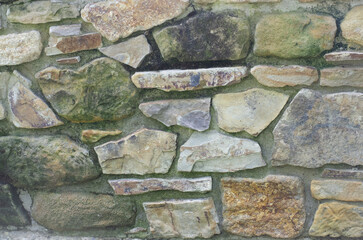 old stone wall background, colored stones texture	
