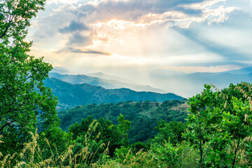 Fototapeta premium Mountain valley during sunset or sunrise. Natural spring or summer season landscape