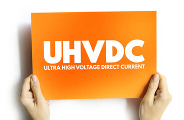 UHVDC - Ultra High Voltage Direct Current acronym on card, abbreviation concept background