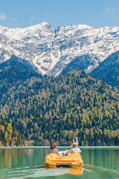 Friends enjoying pedal boat ride on Lake Ritsa