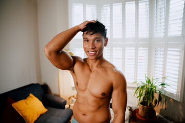 Fototapeta na wymiar Asian man fitness body in apartment