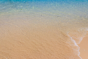 Soft wave of ocean on sandy beach