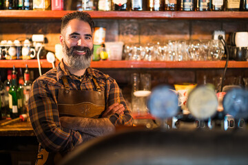 Obraz premium Portrait of barmen at pub. Adult man working as barmen.