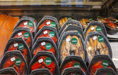 Smoked salmon, cheese and tortillas in a shop window in the Old Market Hall Vanha Kauppahalli in...