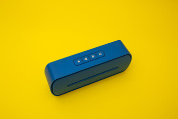 Blue boombox on yellow background, colors of the Ukrainian flag
