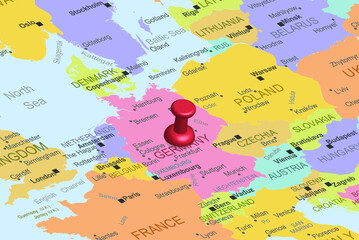 Naklejka premium Germany with red fastener pushpin on europe map, close up Germany, travel idea, colorful map with location icon, vacation concept