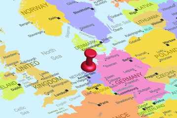 Netherlands with red fastener pushpin on europe map, close up Netherlands, travel idea, colorful map with location icon, vacation concept