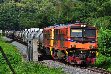 Thai tanker freight-train by diesel locomotive on the railway.