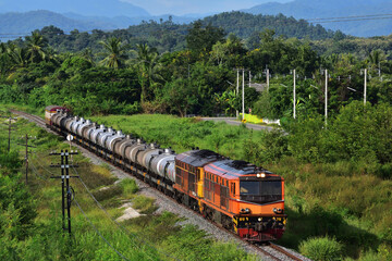 Thai tanker freight-train by diesel locomotive on the railway.
