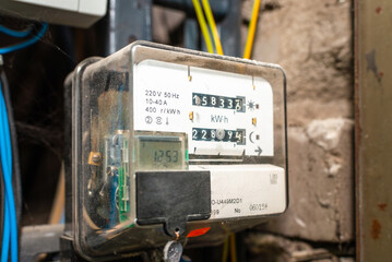 old electric power meter counter measuring power usage.indoors shot.