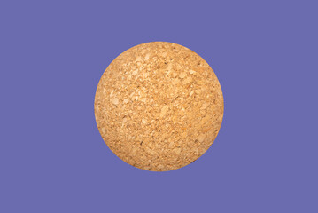 Nice brown cork ball isolated on the veri peri purple background,close up,selective focus.Advertisement.Copy space.
