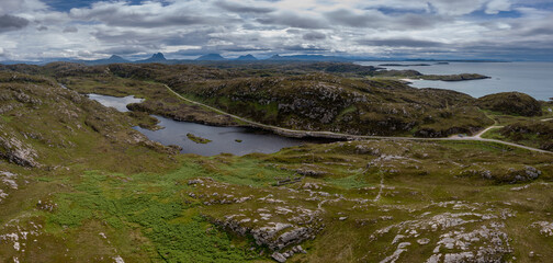 coastal road on the North Coast 500 scenic drive in the Scottish Higlands near Lochniver