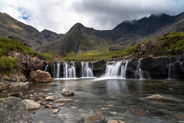 Fototapeta na wymiar the idyllic and picturesque cascades and pools at the Fairy Pools of the River Brittle on the Isle of Skye