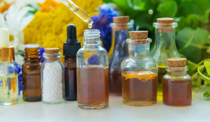 Tinctures, extracts, oils and dietary supplements from medicinal herbs. Selective focus.