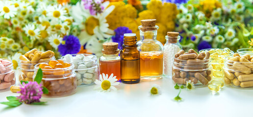 Tinctures, extracts, oils and dietary supplements from medicinal herbs. Selective focus. - obrazy, fototapety, plakaty