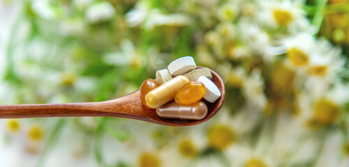 Homeopathy and dietary supplements from medicinal herbs. Selective focus.