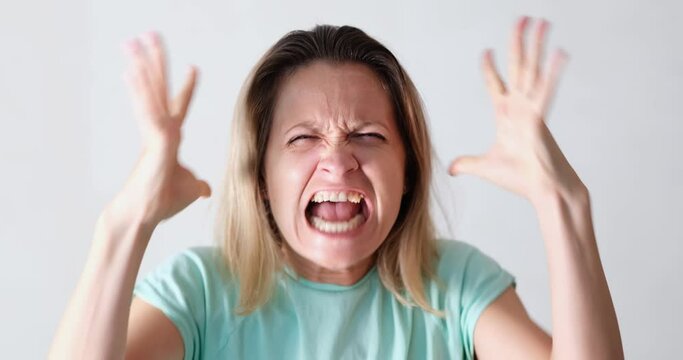 Portrait of angry emotionally nervous screaming woman