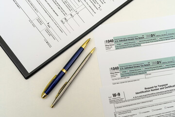 Obraz premium tax forms that require taxpayers to disclose their taxable income for the year.