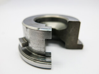 gray iron metal There is 1 piece of black-brown smudges placed on a white background. Clear photos after blurry.