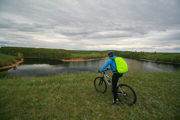 A cyclist on the bank of the Volga River, Russia.