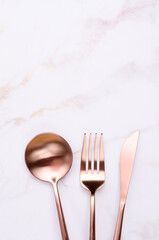 Clean golden metal cutlery