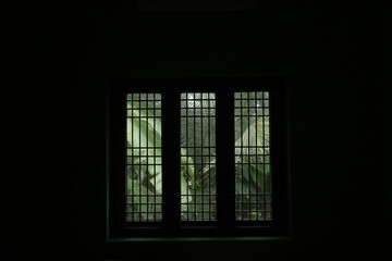 A window in a dark room
