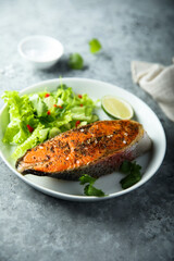Roasted salmon steak with green salad