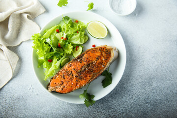 Roasted salmon steak with green salad