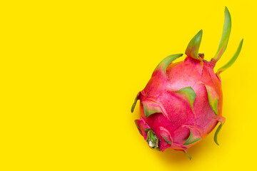 Ripe dragonfruit or pitahaya on yellow background.